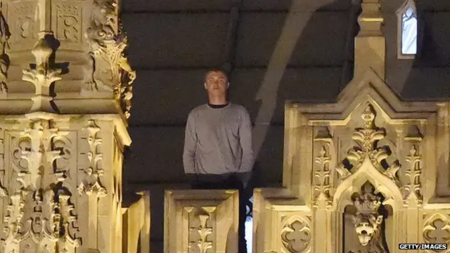 Man on roof of Parliament