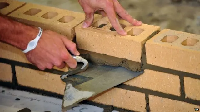 Man laying bricks