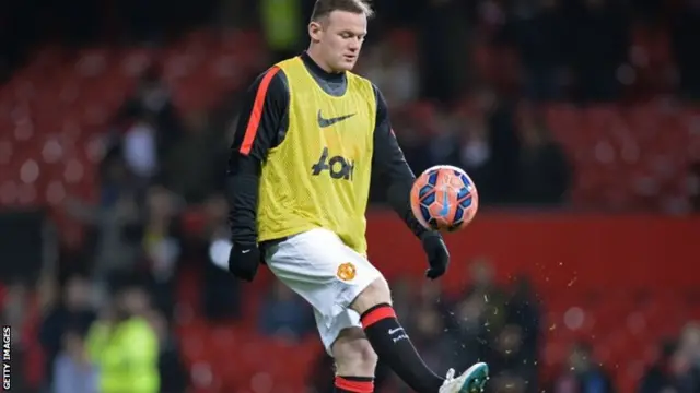 Wayne Rooney warms up