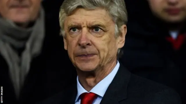 Arsene Wenger looks on