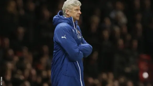 Arsene Wenger looks on