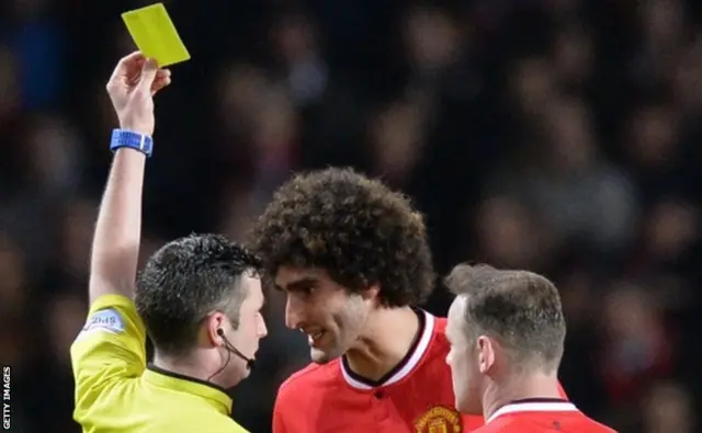 Marouane Fellaini is booked