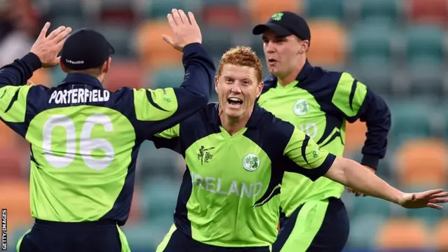 Ireland cricketers William Porterfield (left) and Andrew McBrine (right) celebrate with Kevin O'Brien (centre)