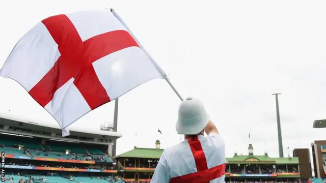 An England fan waves the St George flag