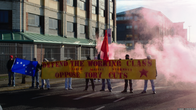 Protesters who called themselves "grassroot socialists" caused traffic disruption in the Millfield area of Belfast during Friday morning's rush hour