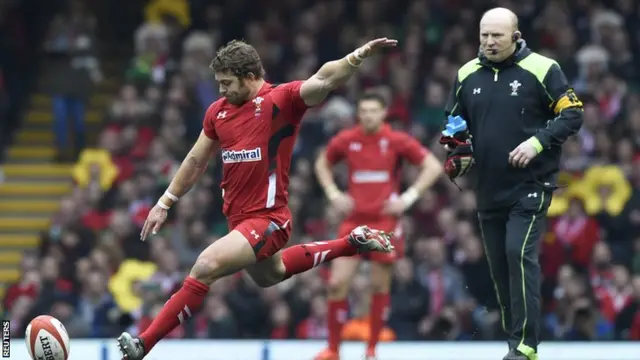 Leigh Halfpenny lands his third kick as Neil Jenkins looks on