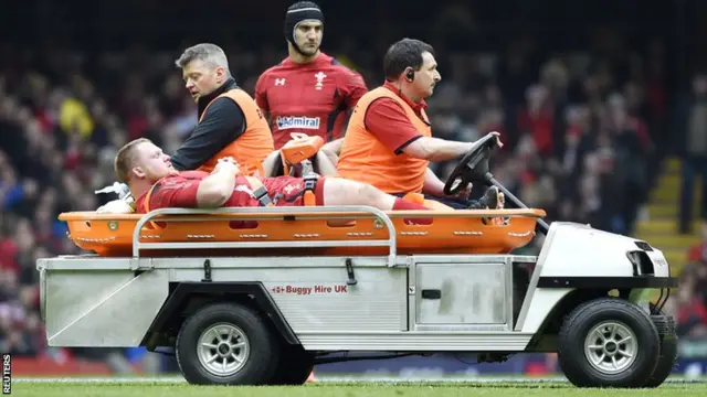 Samson Lee is taken off on a stretcher