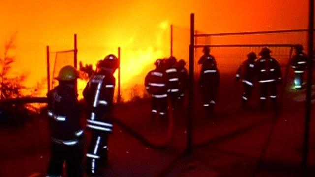 Fire fighters tackle the blaze in Chile