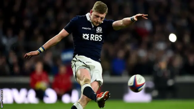 Finn Russell kicks clear for Scotland