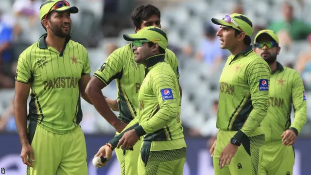 Umar Akmal, centre, celebrates after catching Stuart Thompson