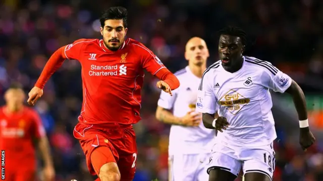 Liverpool's Emre Cam and Swansea's Bafetimbi Gomis