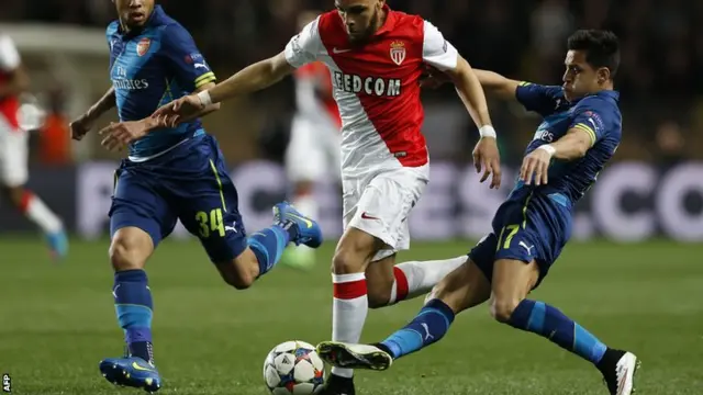 Alexis Sanchez challenges for the ball