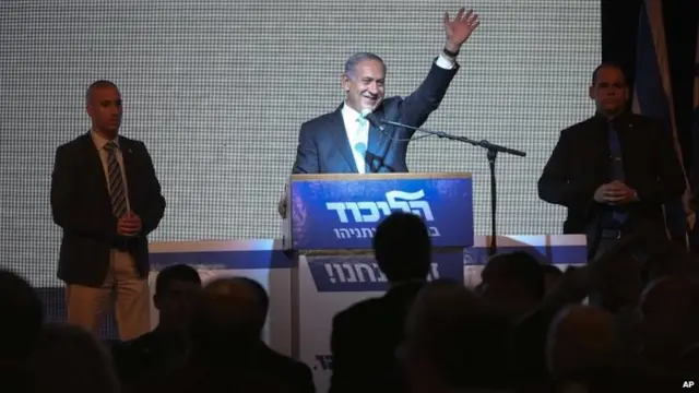 Israeli Prime Minister Benjamin Netanyahu greets supporters at the party"s election headquarters In Tel Aviv.Tuesday, March 17, 2015