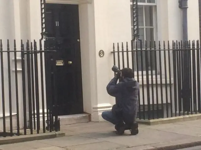 Photographer outside No 11