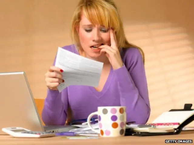 Woman struggling with paperwork
