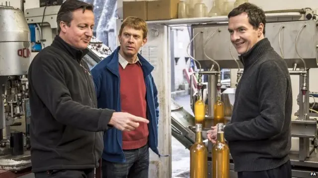 David Cameron and George Osborne at a cider plant