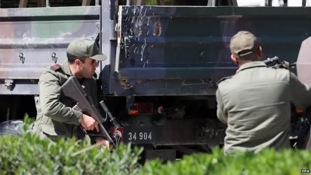 Members of the Tunisian armed forces take up a position after gunmen reportedly took hostages near the country"s parliament, outside the National Bardo Museum, Tunis, Tunisia, 18 March 2015