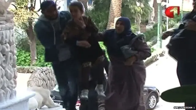 An image grab taken from the state-run Tunisia 1 channel on March 18, 2015 shows people escaping from Tunis" famed Bardo Museum during an attack by two men - March 18, 2015