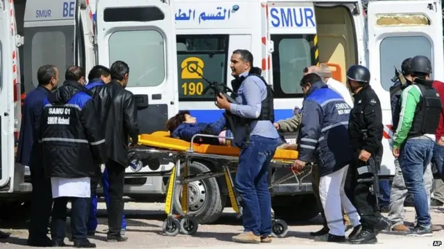 A victim being evacuated by rescue workers outside the Bardo musum in Tunis