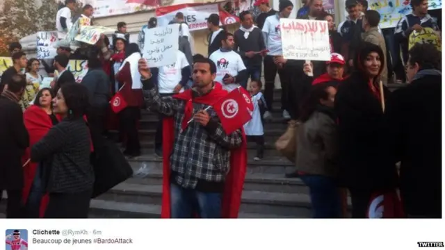 Groups of young people arrive outside a theatre on Avenue Bourguiba, in the centre of Tunis - March 18, 2015