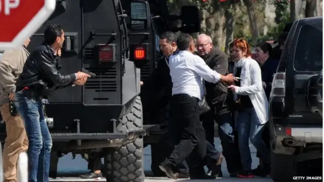 Tourists are evacuated from the site of an attack carried out by two gunmen at Tunis" famed Bardo Museum on March 18, 2015