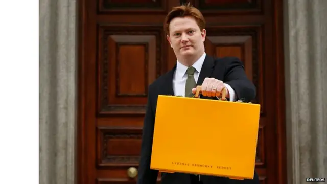 Chief Secretary to the Treasury Danny Alexander poses with the Lib Dems alternative Budget box