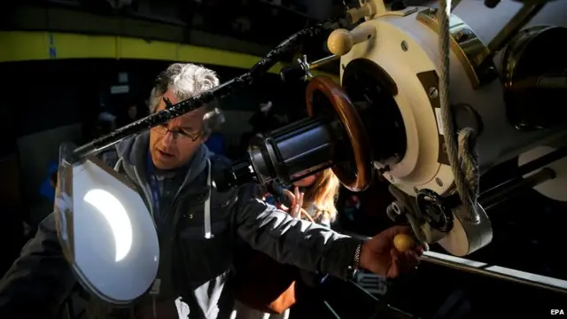 The solar eclipse is projected onto a flat surface through a telescope in the Insulaner Observatory in Berlin, Germany.