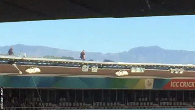 Men on roof of Westpac Stadium