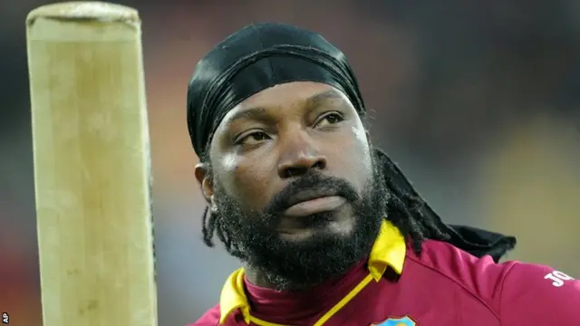 Gayle wabes his bat as he is dismissed