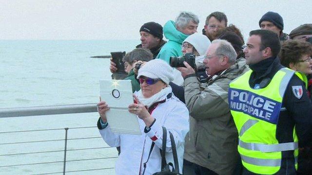 Crowds looking at water