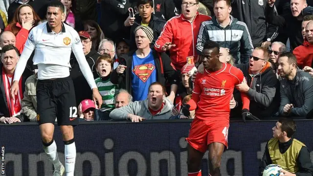 Liverpool fans hold Mario Balotelli back