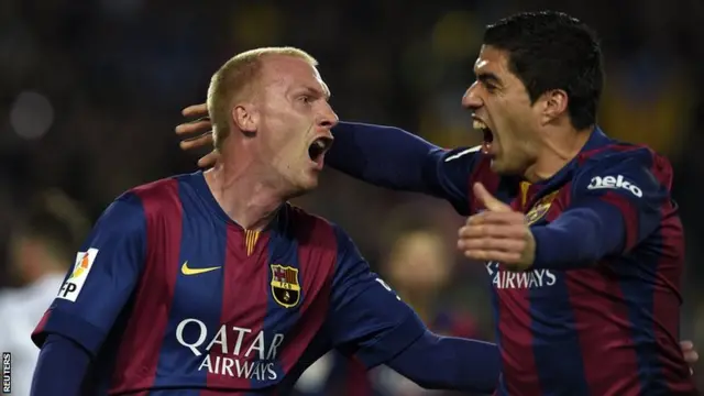 Suarez and Jeremy Mathieu celebrate