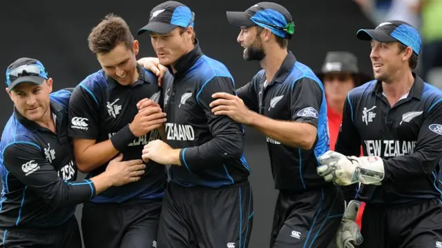 Trent Boult is congratulated by teammates