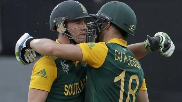 South Africa's AB de Villiers (L) and Faf du Plessis celebrate their 100 run partnership during his Cricket World Cup semi final against New Zealand in Auckland