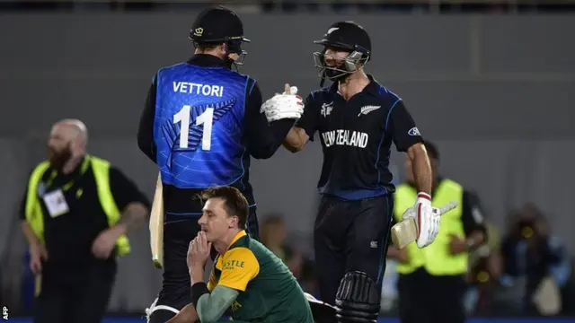 Grant Elliott (right) and Daniel Vettori (left) celebrate in front of South Africa's Dale Steyn