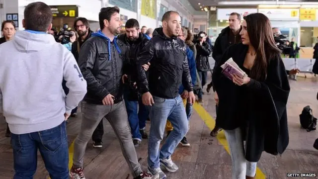 A relative (C) of passangers of the Germanwings plane crashed in French Alps arrives at the Terminal 2 of the Barcelona El Prat airport on March 24, 2015 in Barcelona, Spain