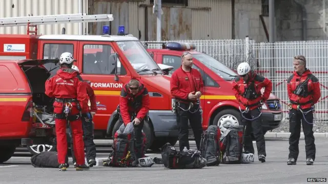 In Digne-les-Bains, firefighters prepare to travel to the crash site