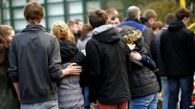 Students and well wishers gather in front of the Joseph-Koenig secondary school in Haltern am See, western Germany on 24 March, 2014