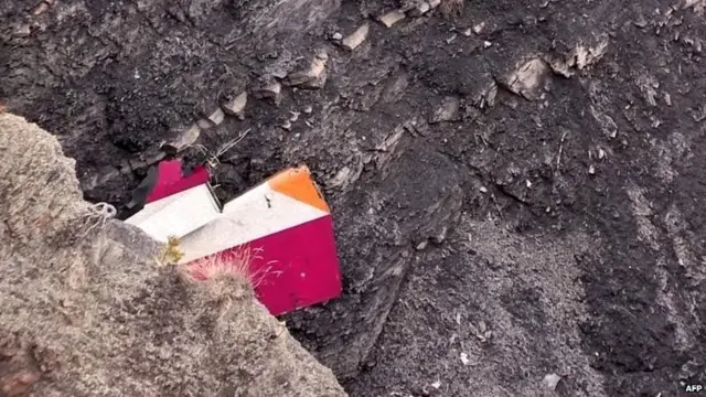 Part of the vertical stabiliser of the Germanwings Airbus A320 at the crash site in the French Alps above the south-eastern town of Seyne