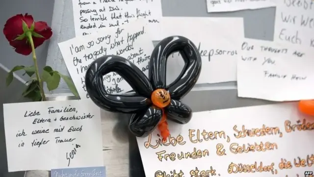 Condolence messages for the victims of the plane crash are fixed on a pole on Wednesday in the departure area of the airport in Duesseldorf, western Germany