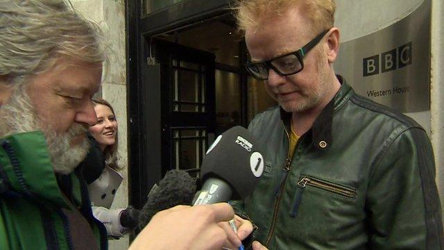 Chris Evans talking to reporter