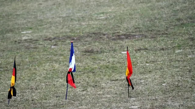 German, French and Spanish flags