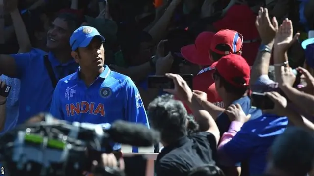 MS Dhoni leads his team out