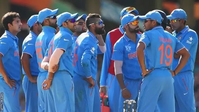 Ravindra Jadeja of India and team-mates look at a big screen review