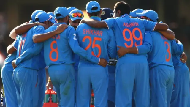 India players celebrate taking a wicket