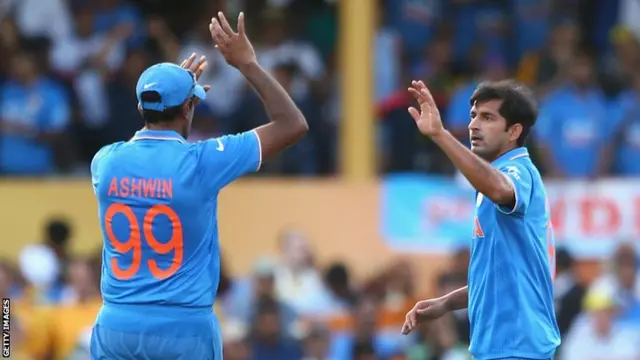 Mohit Sharma (right) of India celebrates dismissing Shane Watson of Australia with team mate Ravichandran Ashwin