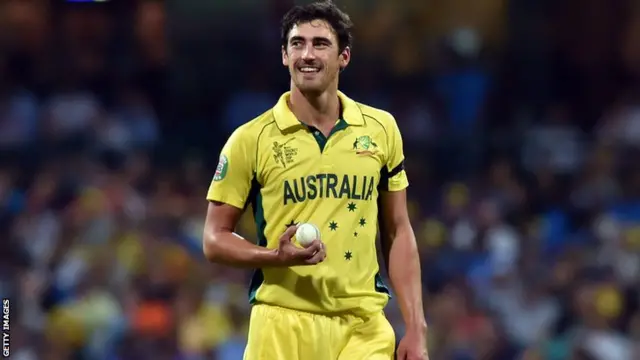 Australia's paceman Mitchell Starc walks towards his bowling mark to bowl against India