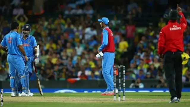 Ajinkya Rahane of India looks dejected