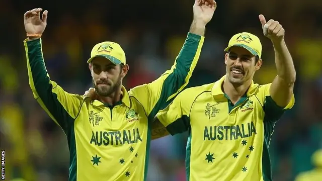 Glenn Maxwell and Mitchell Johnson of Australia wave to the crowd