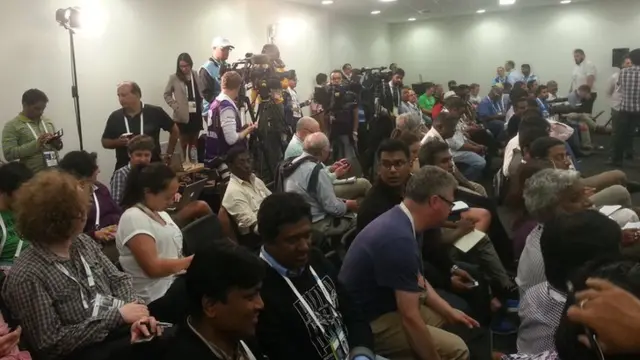 Journalists wait for MS Dhoni